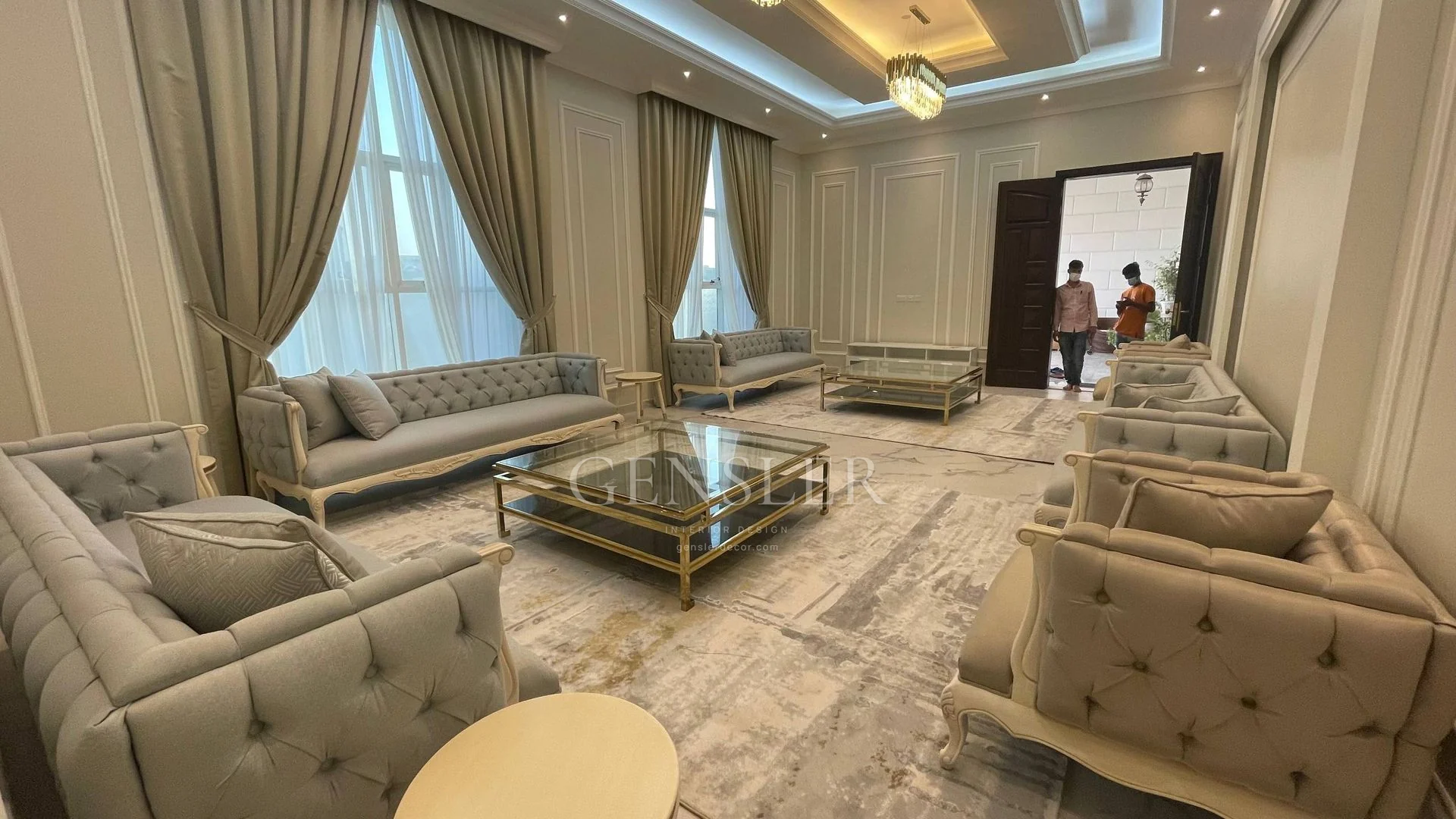 Opposite angle of the classic majlis seating and central glass tables.