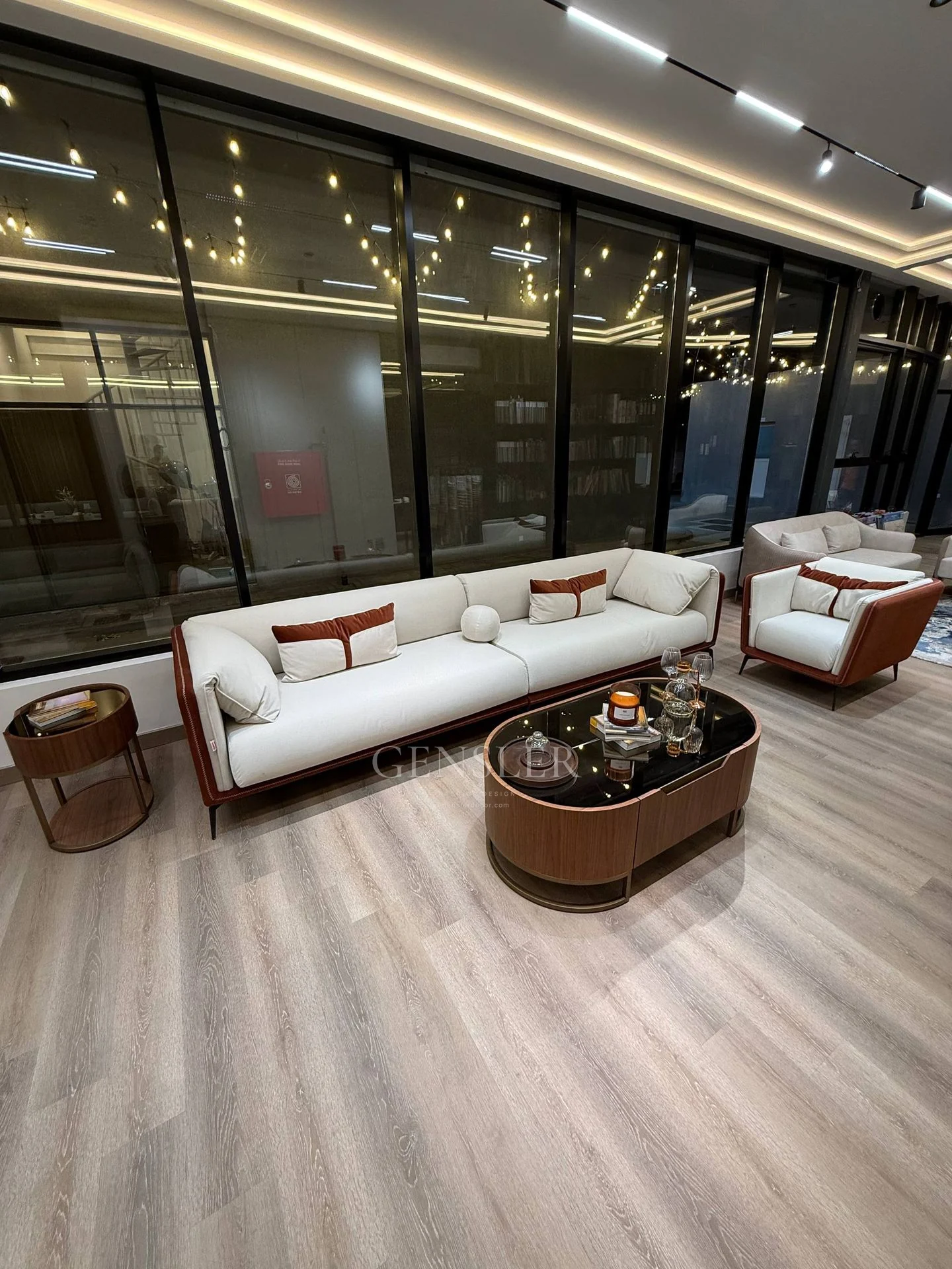 Portrait view of ivory and brown seating with coordinated tables.