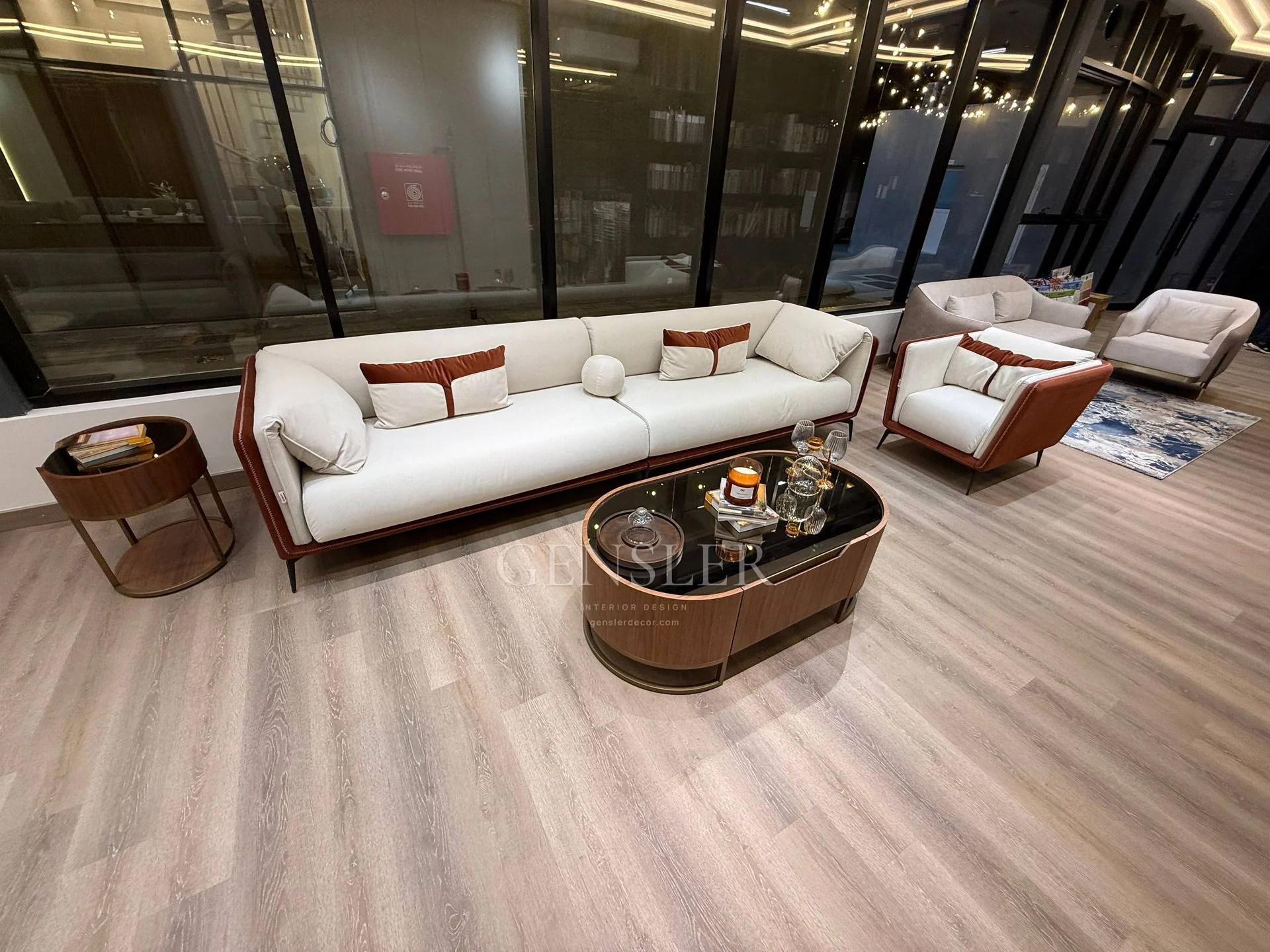 Wide view of the ivory sofa, matching armchair and oval coffee table.